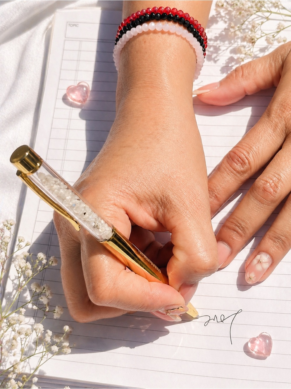 Gold Tone ballpoint pen
with clear barrel with natural stone chips by Awoken4u